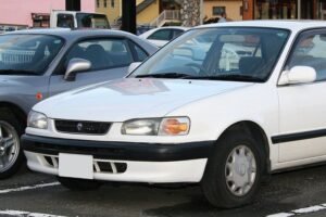 Generasi Kedelapan Toyota Corolla (E110; 1995): Mesin Aluminium 1ZZ-FE & Evolusi Global